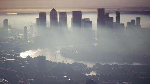 Misty London skyline during sunrise