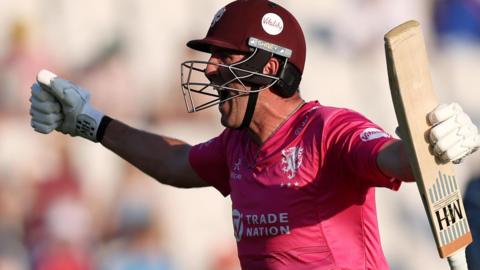 Craig Overton celebrates hitting the winning runs