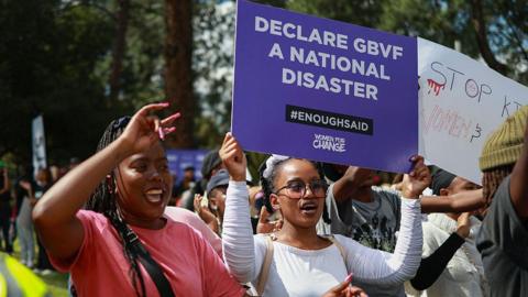 Protesters sing and chant during a demonstration calling for gender-based violence and femicide to be declared a national disaster at the Union Buildings in Pretoria on April 11, 2025