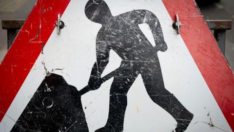 A close-up of a roadworks sign.