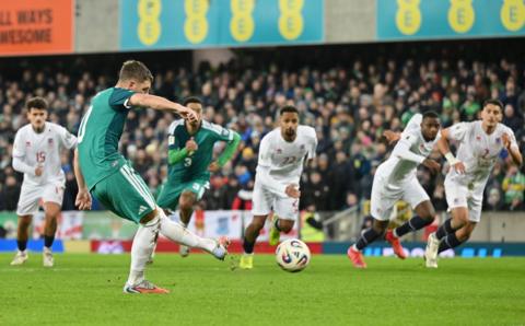 Jamie Donley of Northern Ireland scores his team's first goal from the penalty spot during the FIFA World Cup 2026 qualifier match between Northern Ireland and Luxembourg at Windsor Park