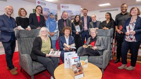 An image of Vi Dempster, Leicester’s assistant city mayor for leisure and culture, Paul Angrave from the Universities Partnership, and Christine Radford, Leicestershire County Council’s lead member for adults and communities, with partners who have worked on the project. 