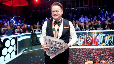 Shaun Murphy holds the Masters trophy