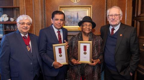 Councillor Bhupen Dave, Prof Sir Nilesh Samani, Elvy Morton and Sir Peter Soulsby (from left to right)
