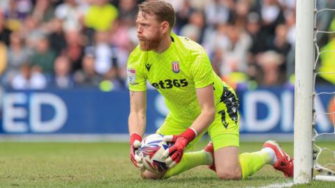 Stoke City goalkeeper Viktor Johansson holds the ball after making a save in the 0-0 draw at Derby