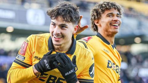 Rodrigo Gomes celebrates with a smile for Wolves