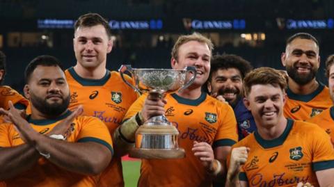 Harry Wilson of Australia celebrates with the Ella-Mobbs Trophy 