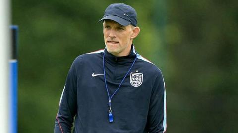 Thomas Tuchel wearing a baseball cap and England branded top during a training session at the World Cup