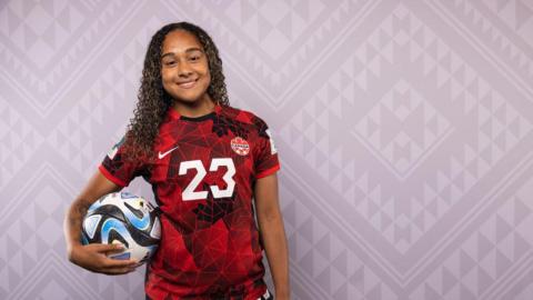 Olivia Smith holding a football.