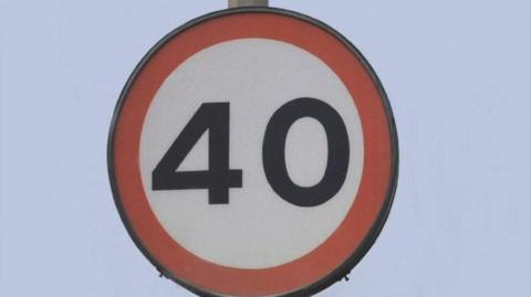 A picture of a 40 mile per hour speed limit. It is a white sign with a red circle around it.