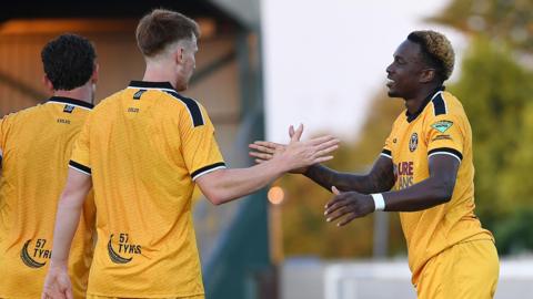 Shaquille Gwengwe celebrates scoring for Newport County at Newport City