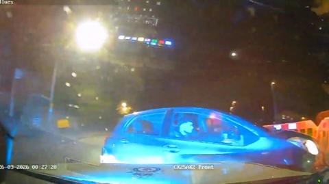 A screengrab of the police car camera. It shows a car colliding with the police car. 