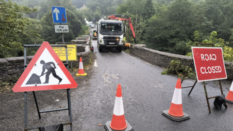 Image shows road closure on bridge.