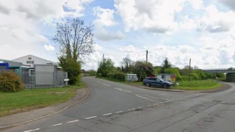Streetview image of Lodge Lane in Tuxford, a semi rural road going past a light industrial area