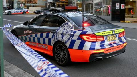 Police road blocks are seen at Bondi Junction after police responded to reports of multiple stabbings inside the Westfield Bondi Junction shopping centre in Sydney, Australia