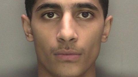 A mugshot of Idris Rahman