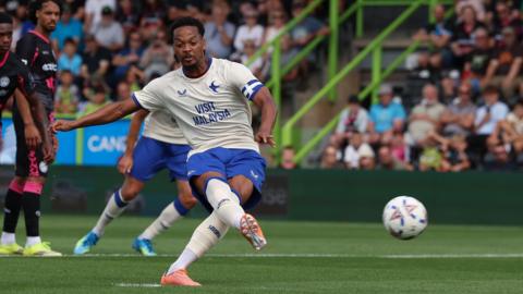 Chris Willock scores a penalty for Cardiff City at Forest Green Rovers