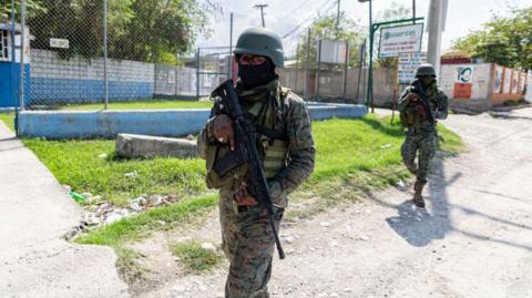 PORT-AU-PRINCE, HAITI - MARCH 06: A Haitian soldier stands guard at the entrance to Port-au-Prince international airport after armed gang members exchanged gunfire with police and soldiers around the airport in Port-au-Prince, Haiti on March 06, 2024. 