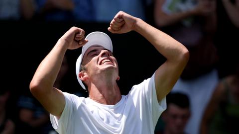 Oliver Tarvet celebrates beating Switzerland's Leandro Riedi on his Wimbledon debut