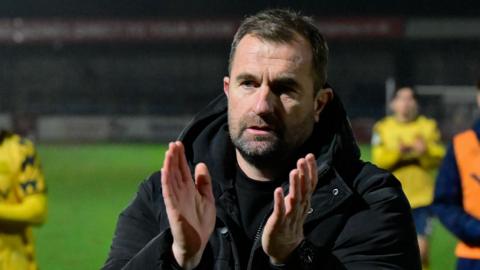 Paul Wotton applauds the Torquay fans