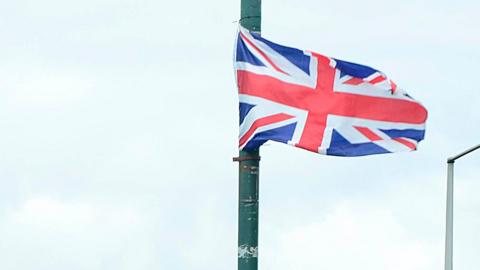 A union flag flying from a lamp post
