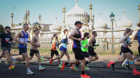 Runners going past the Royal Pavilion in Brighton. 