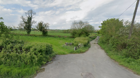 A google street view shot from the A361 looking over hedgerows and fields near Frome in Somerset