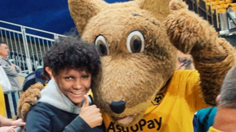 Harleigh Hepworth hugging a Wolves mascot