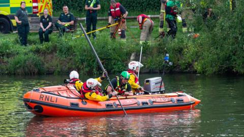 Search team looking in the river