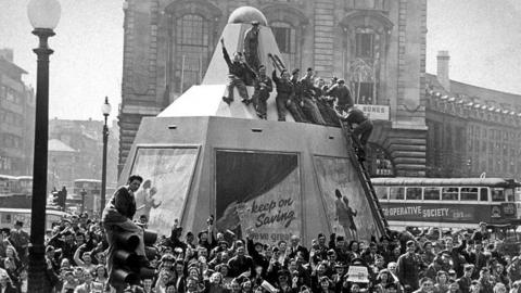 Archive photograph of crowds at Piccadilly Circus in London