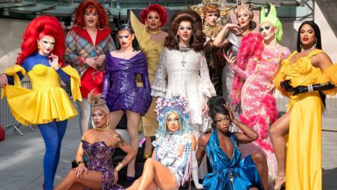 Drag queens Charra Tea, Chanel O'Conor, Actavia, La Voix, Lill, Marmalade, Dita Garbo, Kyran Thrax, Rileasa Slaves, Saki Yew, Zahirah Zapanta and Kiki Snatch posing outside of ˿ broadcasting house in London.