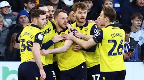 Oxford players celebrate Sam Long's opener in the win over Leicester City
