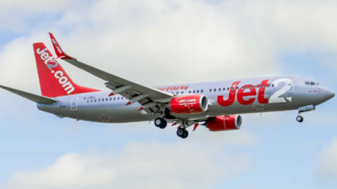 A Jet2 plane flying in the sky.