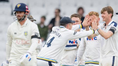 Yorkshire celebrate a Durham wicket at Headingley
