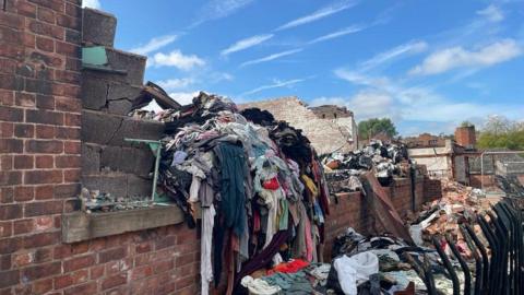 A building and clothes damaged by blaze.