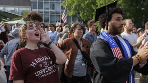 Harvard University students chant with fellow students