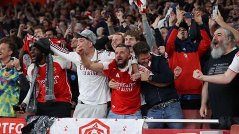 Arsenal fans celebrate from the stands