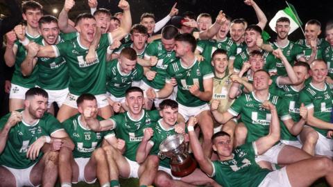 Newbridge players celebrate winning at Celtic Park