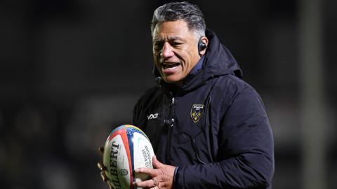 Dragons Interim head coach Filo Tiatia holding a ball during a pre-match warm up