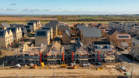 Drone view of a residential building site under construction - stock photo