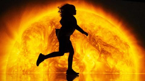 A child's silhouette in front of a burning planet image from the ancestry in the stars exhibit that forms part of YOU:MATTER, after the cutting-edge experience opened at the National Science and Media Museum in Bradford. Created by renowned artist collective Marshmallow Laser Feast 
