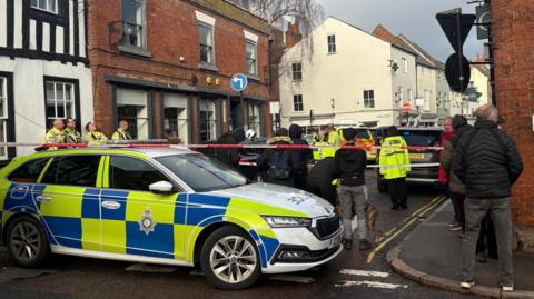 Armed officers and other emergency service personnel were deployed to Queen Street 