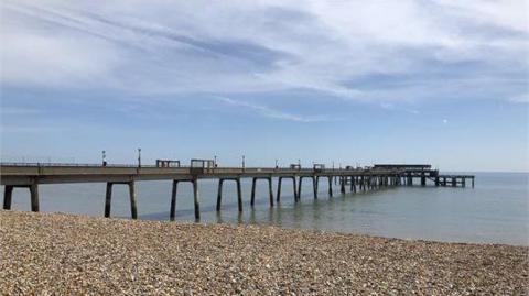 Deal Pier as pictured from the stony beach. 