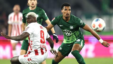  Ragnar Ache of 1.FC Koln and Moritz Jenz of VfL