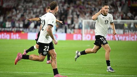 Florian Wirtz celebrates scoring