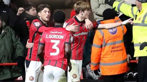 Nathan Lowe celebrates scoring Walsall's third against Notts County