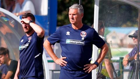 A close up of John Askey, the Truro City boss, standing on the touchline during the National League South tie against Tonbridge Angels.