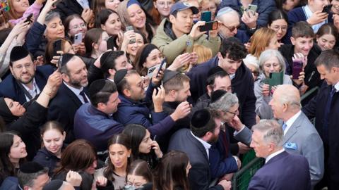 Crowds of people stretch to greet King Charles