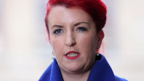 Louise Haigh, who has bright red hair and a blue coat on, seen outside BBC Broadcasting House