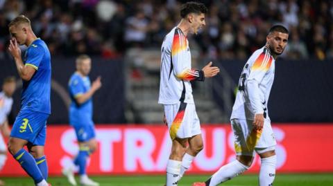 Germany's Kai Havertz and Deniz Undav look disappointed